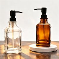 Distributeur de savon en verre ambré carré épais de haute qualité de 500 ml avec pompe manuelle en acier inoxydable noir au design moderne pour la salle de bain