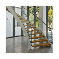 Escalier moderne en bois, pierre et verre, à marches droites, courbes et cercles, de haute qualité