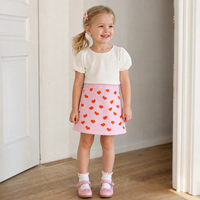 Jupe en tricot rose pâle pour filles, motif cœur, coupe trapèze, mini-jupe tricotée douce et chaude pour tout-petits, jupe pull Saint-Valentin pour enfants, vente en gros