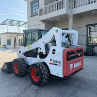 Chargeuse compacte Bobcat d'occasion avec bras de levage vertical, longue portée de déchargement, puissance élevée, faible taux de défaillance
