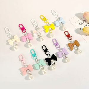 Wholesale Luxury PVC Bow Keychain Carabiner Keyring with Small Pearl Pendant for Bags and Cars - Product Image 3