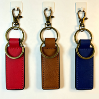 Porte-clés en cuir PU de luxe avec logo personnalisé en relief, en gros, pour cadeaux d'entreprise et souvenirs d'événements professionnels