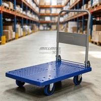 Chariot à plateforme robuste à quatre roues en plastique pour la manutention de matériaux en entrepôt et en supermarché