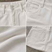 Minigonna in denim bianco da donna, asimmetrica con doppio bottone frontale, gonna in jeans a vita alta, modello A-line estivo, all'ingrosso