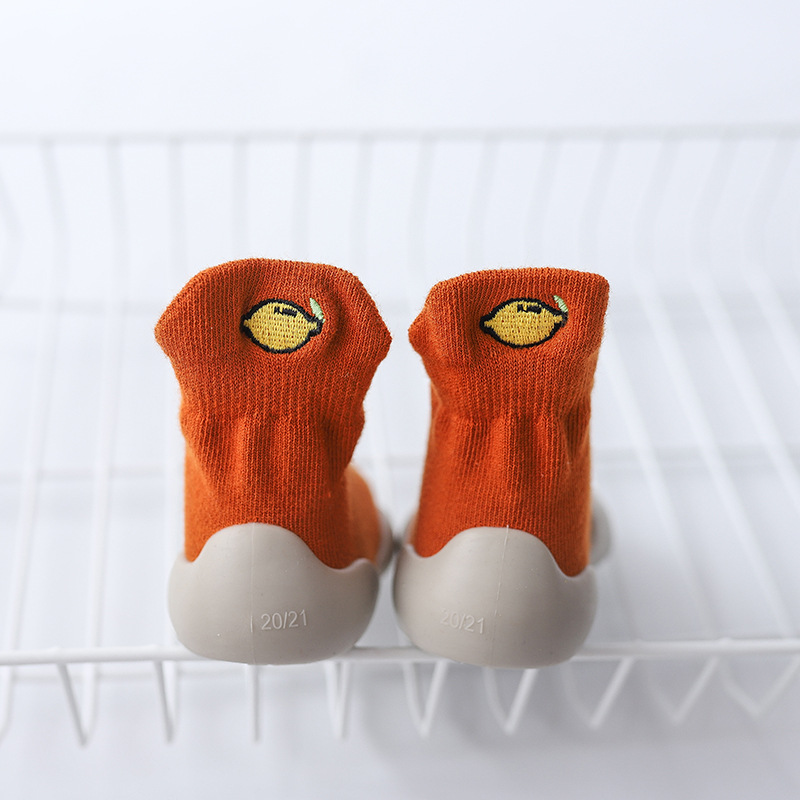 Orange-embroidered lemon