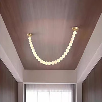 Lustre moderne de luxe en albâtre avec pendentif LED en forme de boule de perles, idéal pour chambre, hôtel et décoration intérieure