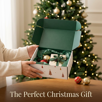 Boîte d'expédition personnalisée pour cadeaux de Noël, motif flocon de neige et étoile argenté sur fond bleu marine, en carton ondulé recyclable