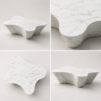 Table basse/de salon sculpturale irrégulière en marbre artificiel, design moderne, finition mate, aspect pierre marbrée, mobilier de maison