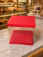 Boîte à gâteau avec couvercle en papier rouge, base rouge et panneaux latéraux transparents. Matériaux de qualité alimentaire, écologiques et recyclables.