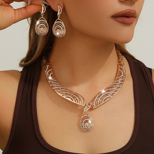 Cross-border Europe and the United States hot gold zinc alloy inlaid rhinestone hollow necklace earrings set ladies jewelry - Product Image 1