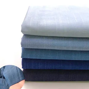 Tissu Denim bleu en coton délavé pour pantalons, chemise, jupe, accessoires de couture, vente en gros