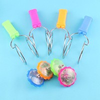 Vente en gros de jouets lumineux de vendeur de rue pour enfants toupie volante magique