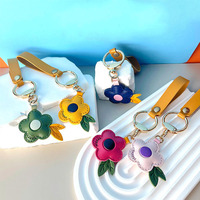 Mignon pendentif fleur en cuir PU en trois dimensions porte-clés élégant