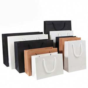 KM Prix de gros bon marché Sacs de shopping en papier d'art de luxe personnalisés imprimés créatifs réutilisables pour les vêtements - Product Image 2