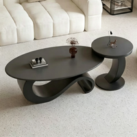 Ensemble de tables basses ovales de luxe léger avec plateau en dalle de pierre et structure métallique, tables gigognes minimalistes pour salon avec table d'appoint