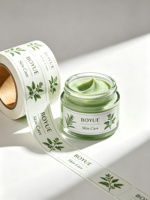 Étiquettes cosmétiques personnalisées minimalistes vertes, autocollants mats blanc cassé en rouleau pour masques faciaux, crèmes, lotions et contenants en verre