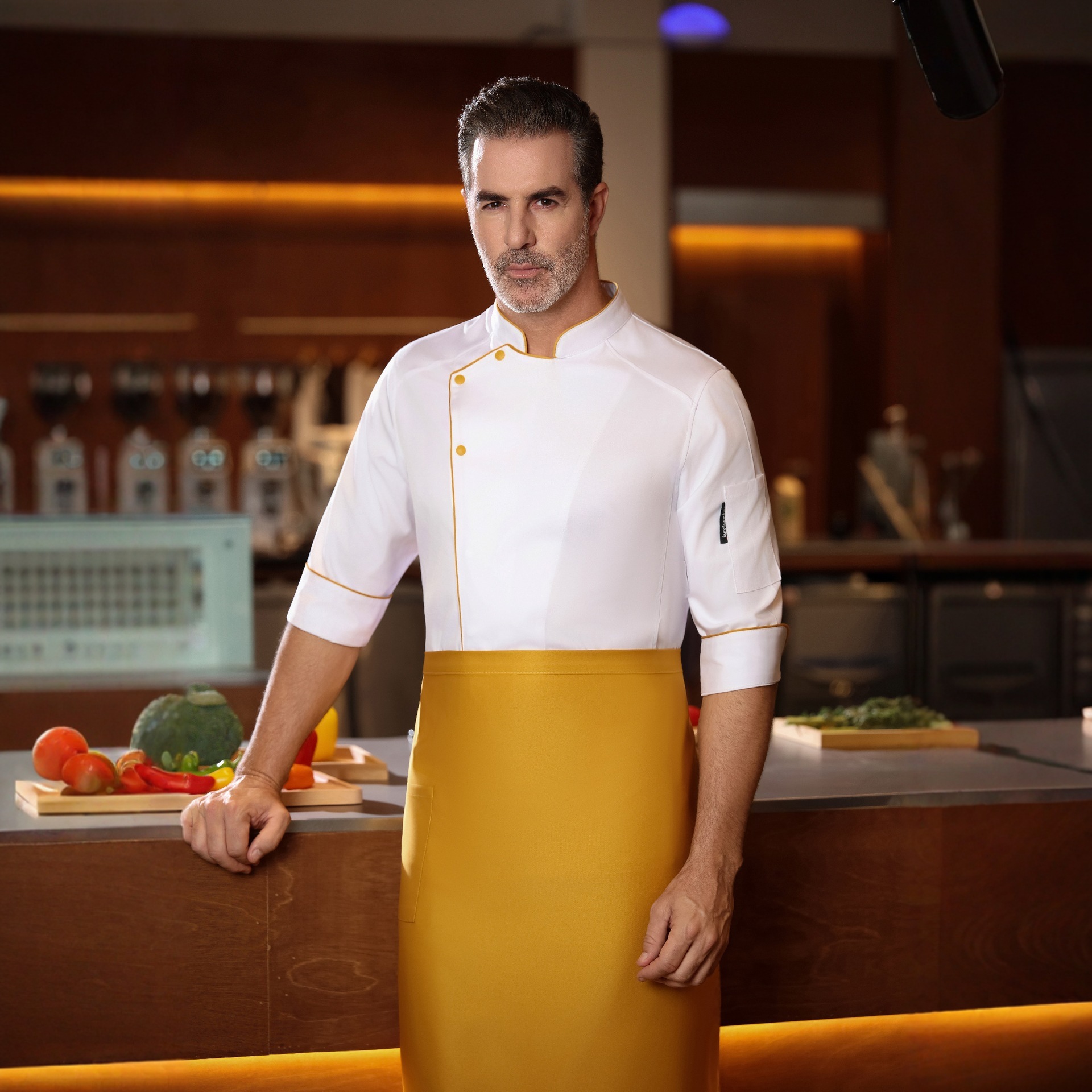 White jacket with yellow trim and short sleeves, yellow apron