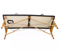 Table de massage et de soin du visage moderne en cuir synthétique pliable de luxe, portable, en bois, pour hôtel, salle de sport, salle de bain