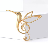 Broche classique en alliage plaqué or moulé sous pression, motif oiseau ajouré et clé de sol, pour la vente en gros de bijoux