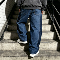 Jean en denim pour homme, coupe baggy à jambe large, avec broderie de patch personnalisée, imprimé et patchwork color block, par un fabricant de denim
