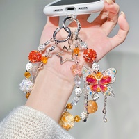 Breloque de téléphone en strass et perles, motif papillon orange et étoile, pendentif de sac artisanal, cordon de poignet, cadeau bijou pour femme