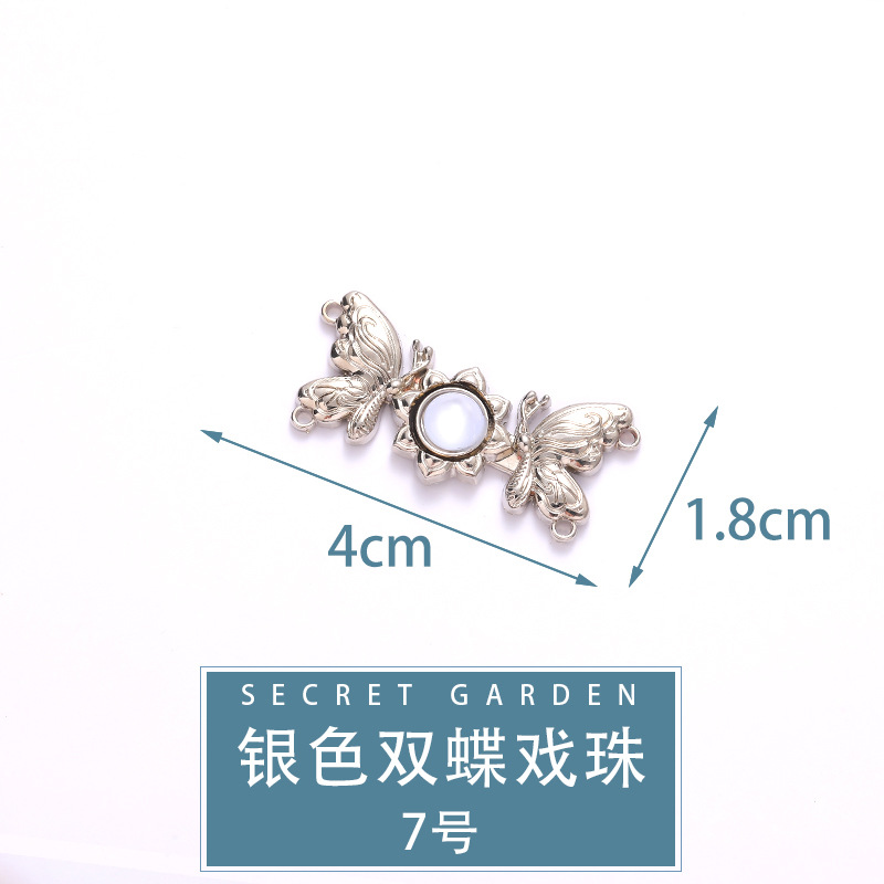 N &deg; 7 [perles de jeu double papillon argent]