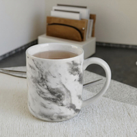 2025 nouvelle tasse en céramique marbre Design personnalisé tasse en porcelaine tasses 11oz blanc noir tasse à café en céramique pour un usage quotidien