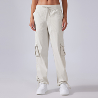 Vente en gros de pantalons de survêtement de studio de danse sportive Pantalon de survêtement léger avec cordon de serrage Tissu en nylon de fitness avec poche froissée sur le côté