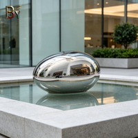 Sculpture de galets en acier inoxydable poli miroir sur mesure pour les jardins d'hôtels, les parcs de bureaux, les installations aquatiques et les places publiques