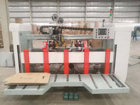 Machine semi-automatique à piquer les boîtes en carton ondulé à double pièce