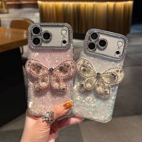 Coque de téléphone à chaîne papillon dégradé avec nœud et coquillage pour iPhone 17 16 15 Pro Max, avec breloques diamantées et lanière scintillante