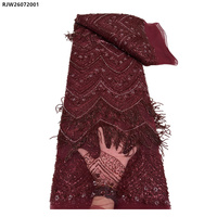 Tissu en dentelle française en tulle nigérian brodé de fleurs, orné de perles, de paillettes et de franges, lourd et élégant