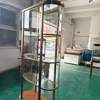 Vitrine de présentation multi-niveaux en verre, ovale et incurvée, sur pied, de luxe, pour bijoux, montres et colliers, pour boutique commerciale