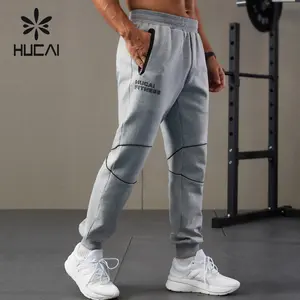 HUCAI custom uomo premium impermeabile cerniera aria cotone poliestere leggero sport 3D silicone logo fitness palestra jogger uomini