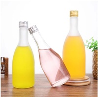 Botellas de vidrio para bebidas y zumo, fabricante de China, con logotipo OEM, a granel