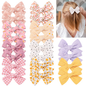 Pinces à cheveux à nœud en tissu imprimé et de couleur unie pour enfants pinces à frange mignonnes accessoires de cheveux pour enfants avec divers motifs - Product Image 1
