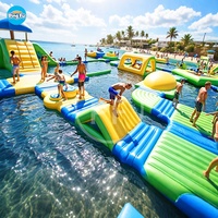 Parc aquatique commercial flottant d'amusement gonflable personnalisé de mer jouets jeux de toboggan d'escalade d'île pour des enfants