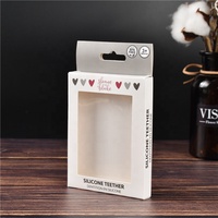 Vente en gros de hochets pour bébés personnalisés avec logo, anneaux de dentition en silicone et boîtes d'emballage en papier pour attaches-tétines