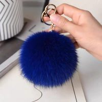 Porte-sac en fourrure de renard véritable, porte-clés mignon en forme de poupée pour sac à dos, accessoire de voiture léger en peluche, style célébrité, texture douce