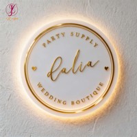 Enseigne lumineuse ronde rétroéclairée blanc chaud avec lettres en miroir argenté, logo personnalisé pour enseigne commerciale de bijouterie, signalétique murale de magasin