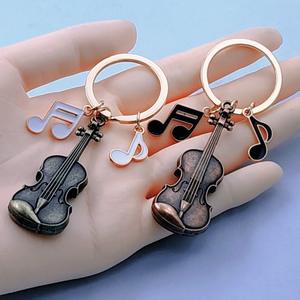 Llavero con nota musical de violín vintage, colgante para mochila, joyería de moda europea y americana, regalo creativo - Product Image 2