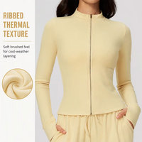 Veste de sport athleisure zippée pour femme, en polaire thermique côtelée, avec passe-pouces, manches longues, coupe ajustée, pour la course et l'entraînement, chaude