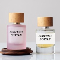 Flacon pulvérisateur de parfum rond cylindrique de 30ml 50ml 100ml personnalisé flacons de parfum en verre rose transparent à sertir vides avec boîte tubulaire