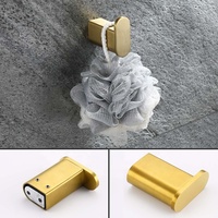 Ensemble d'accessoires de salle de bain modernes en acier inoxydable brossé doré : porte-serviettes, patère, porte-papier toilette
