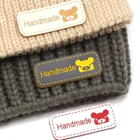 Étiquettes en cuir PU personnalisées avec logo en relief pour vêtements, jeans