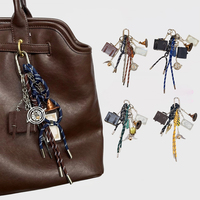 Porte-clés de sac à main de style preppy de qualité JS, breloque de valise, pendentifs billet et chapeau de sorcière, porte-clés de sac à dos avec pompon en corde tressée