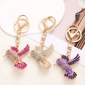Portachiavi con Piccola Colomba Volante, Ciondolo Uccello della Pace con Strass, Accessorio per Borsa e Auto - Product Image 1