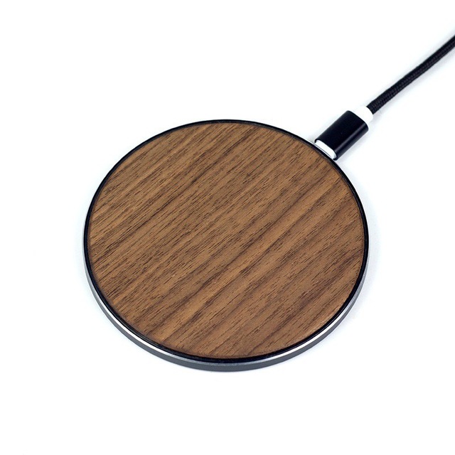 A new 15W fast charging wireless charger made of walnut woodv