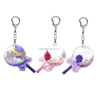 Porte-clés en plastique en forme de sucette rose et violet, rempli de liquide, avec flotteur en résine de baies et confettis scintillants à l'intérieur, idéal pour les cadeaux
