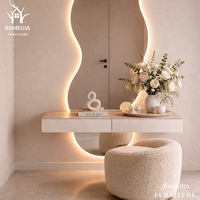 Ensemble de meuble-lavabo mural contemporain avec miroir LED de forme irrégulière et éclairage d'ambiance, coiffeuse flottante, mobilier de chambre moderne